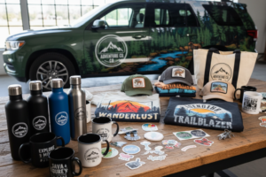 All different kinds of merch: hats, bags, water bottles, all done by Brian Lloyd Designs in Woodland Park, Colorado.